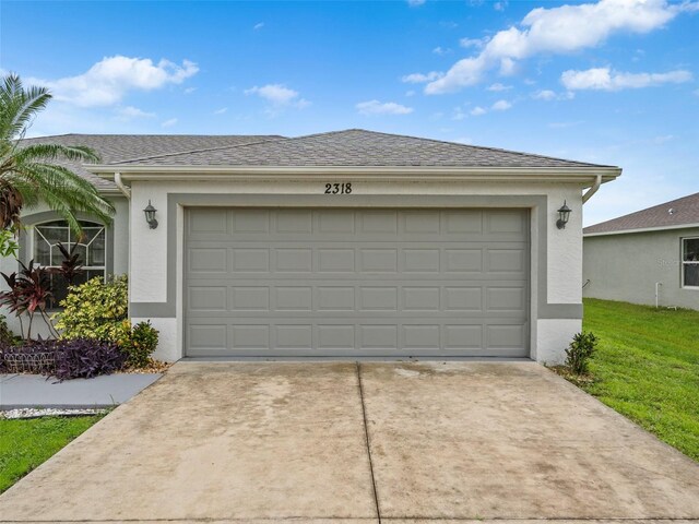 garage with a yard