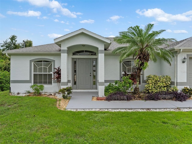 single story home with a front yard