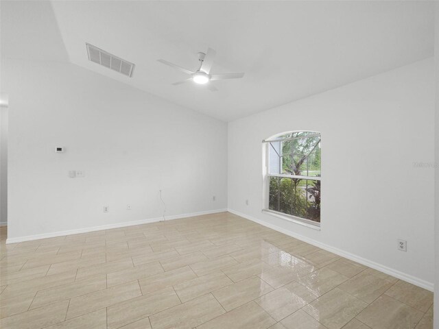 spare room featuring light tile patterned floors and ceiling fan