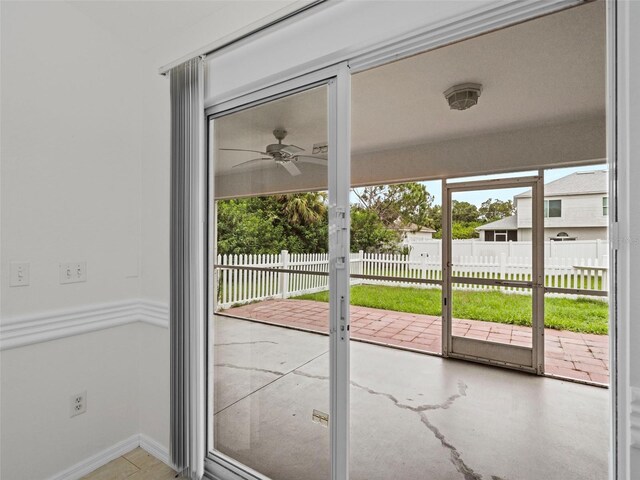 interior space with ceiling fan and french doors