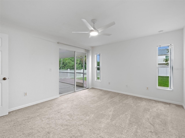 carpeted empty room with ceiling fan