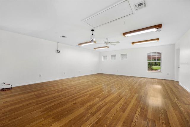 unfurnished room featuring hardwood / wood-style flooring and ceiling fan