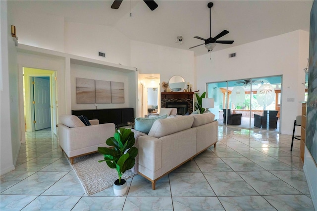 living room featuring high vaulted ceiling and ceiling fan