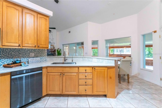 kitchen featuring black dishwasher, decorative backsplash, sink, kitchen peninsula, and light tile patterned flooring