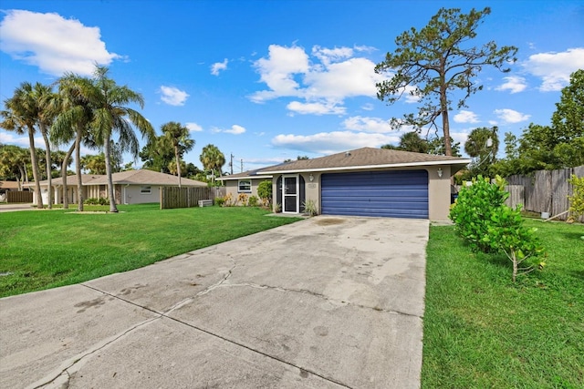 ranch-style home with stucco siding, concrete driveway, an attached garage, a front yard, and fence