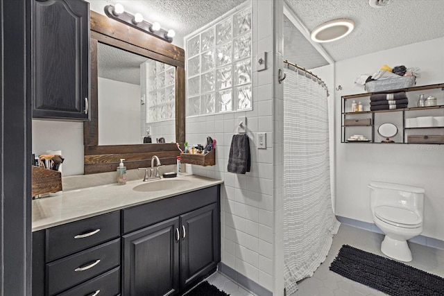 full bath with a shower with shower curtain, toilet, a textured ceiling, and vanity