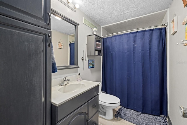 bathroom featuring a shower with shower curtain, toilet, a textured ceiling, vanity, and tile patterned floors