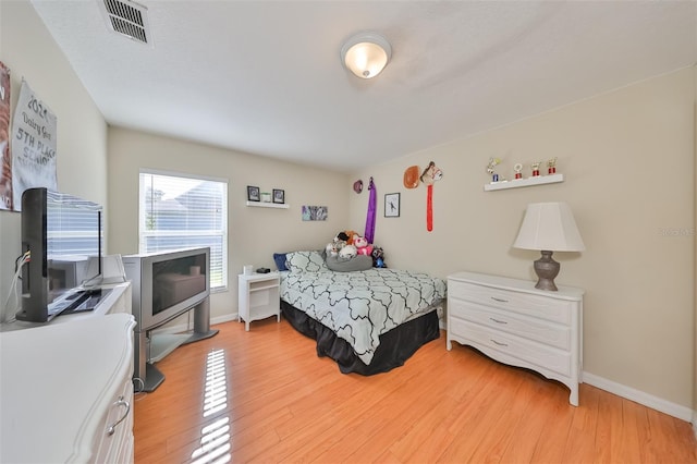 bedroom featuring light wood-type flooring