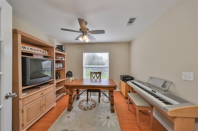 home office featuring ceiling fan and light wood-type flooring