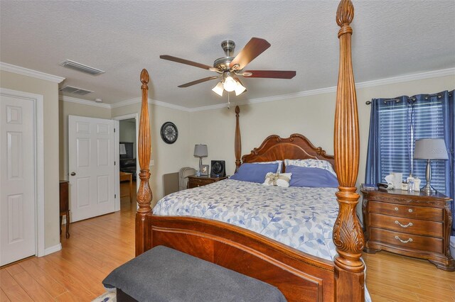 11622 Summit Rock Ct, Parrish, FL 34219 - bedroom with light wood-style floors, crown molding, a textured ceiling, a ceiling fan, and baseboards