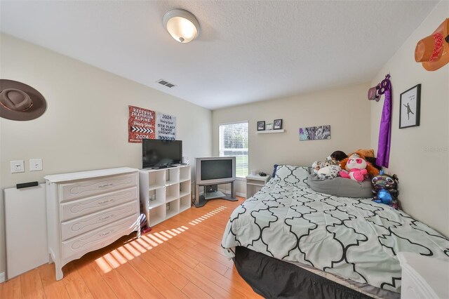11622 Summit Rock Ct, Parrish, FL 34219 - bedroom with light wood-style flooring