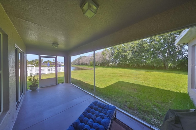 11622 Summit Rock Ct, Parrish, FL 34219 - unfurnished sunroom featuring a water view