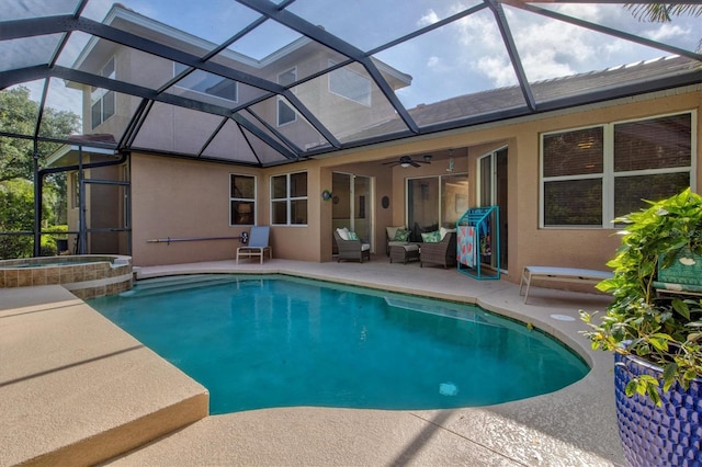 view of pool with an in ground hot tub, a patio, ceiling fan, and a lanai