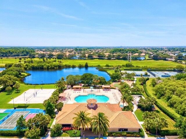 birds eye view of property with a water view