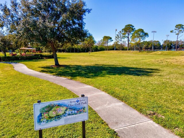 view of home's community with a yard