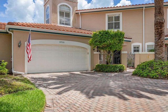 mediterranean / spanish-style house featuring a garage