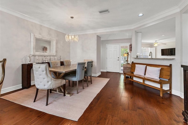 dining space featuring ornamental molding and dark hardwood / wood-style floors