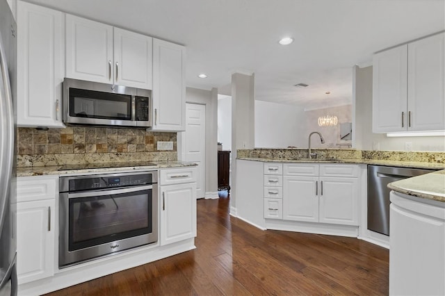 kitchen with white cabinetry, appliances with stainless steel finishes, and sink