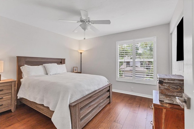 bedroom with dark wood-type flooring and ceiling fan