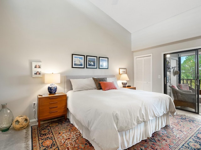 bedroom with access to outside, high vaulted ceiling, carpet, and a closet