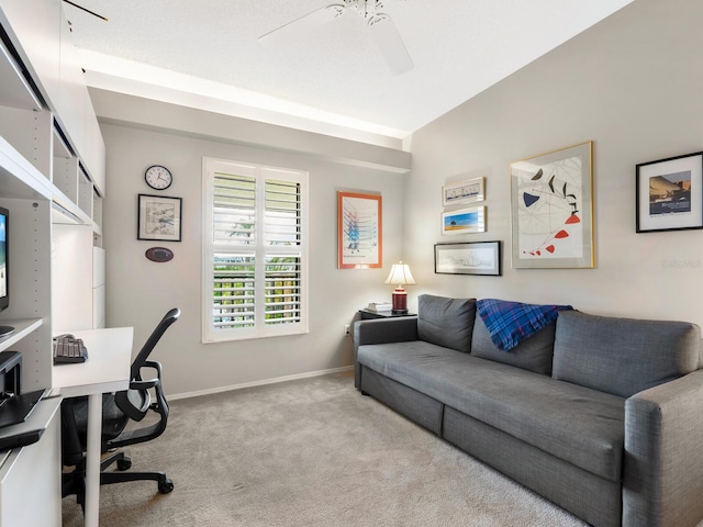 office space with ceiling fan and light carpet