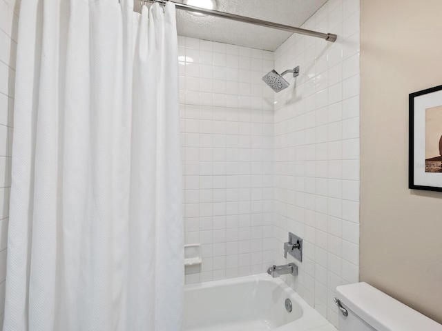 bathroom featuring toilet and shower / bath combination with curtain