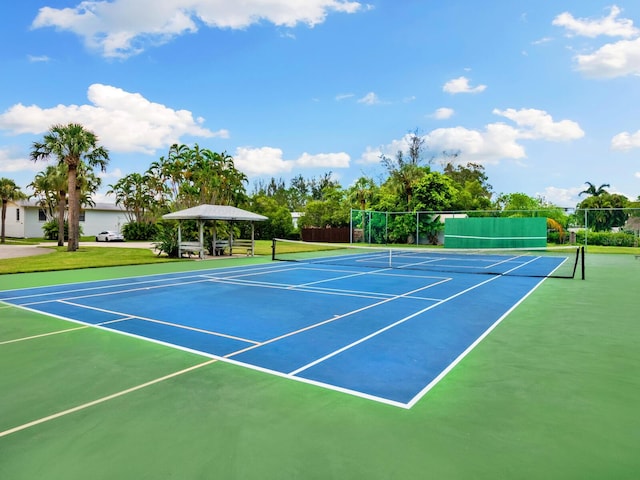 view of tennis court featuring a gazebo