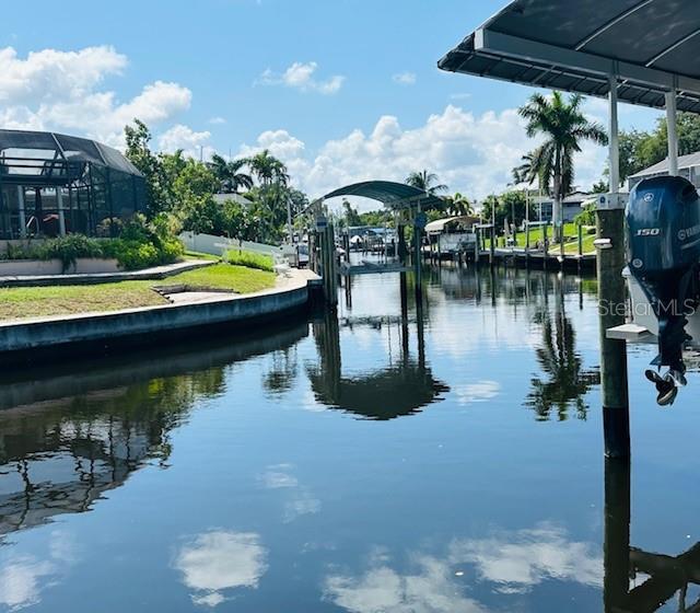 property view of water featuring a dock