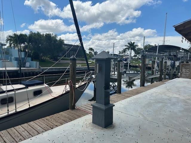 dock area featuring a water view and boat lift