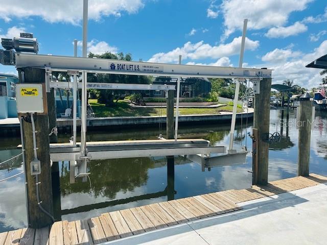 view of dock featuring a water view and boat lift