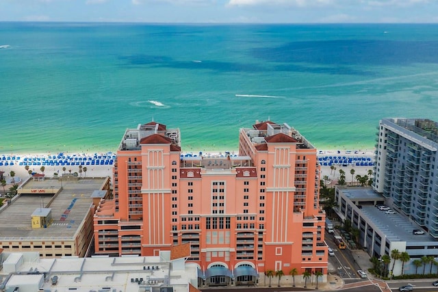 birds eye view of property featuring a view of the beach and a water view