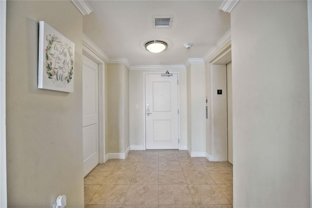 hallway with crown molding and elevator