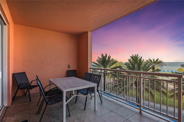 balcony at dusk with a water view