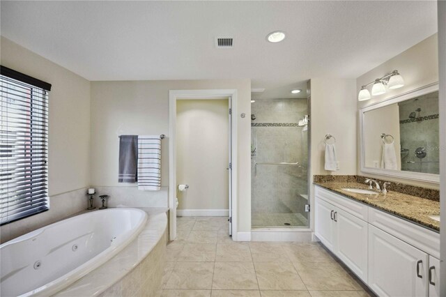 bathroom with independent shower and bath, vanity, and tile patterned floors