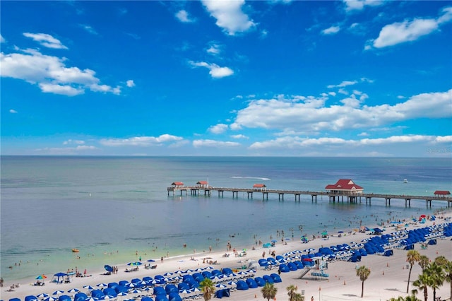 view of water feature with a dock and a view of the beach