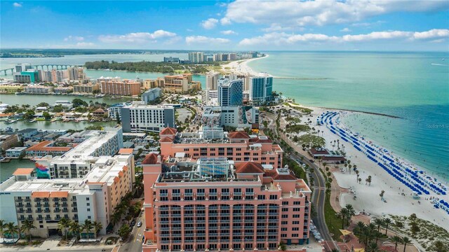 birds eye view of property with a view of the beach and a water view