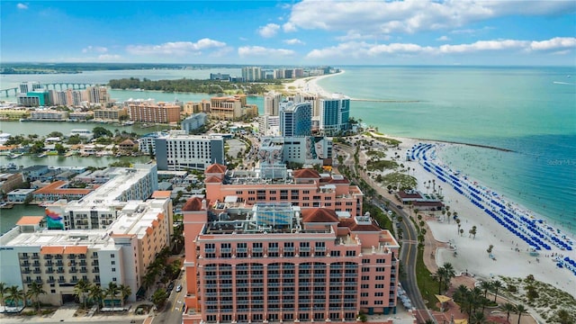 aerial view with a water view and a beach view