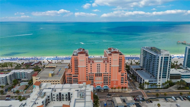 bird's eye view featuring a view of the beach and a water view