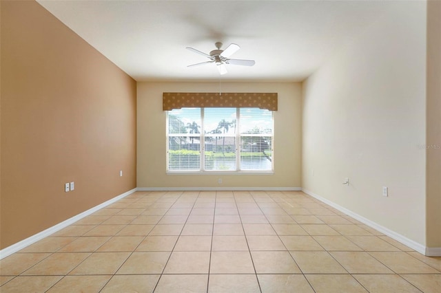 tiled empty room with ceiling fan