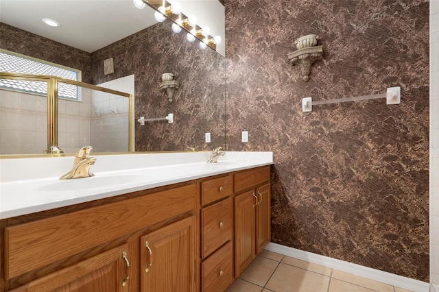 bathroom featuring tile patterned flooring and dual bowl vanity