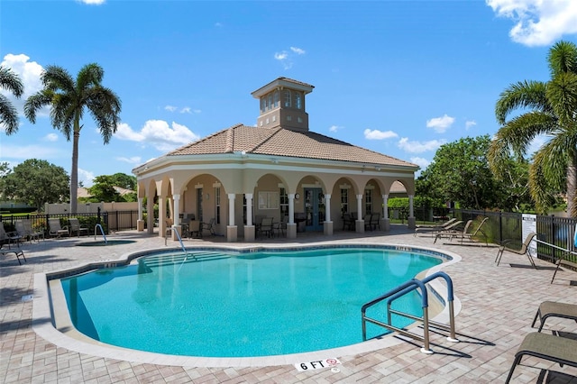 view of swimming pool with a patio