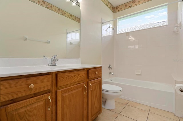 full bathroom with vanity, toilet, tile patterned floors, and tiled shower / bath