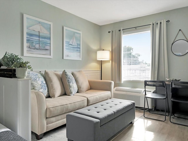 living room with light hardwood / wood-style floors and a wealth of natural light