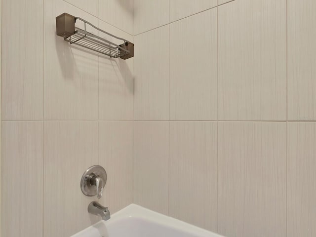 details featuring tub / shower combination