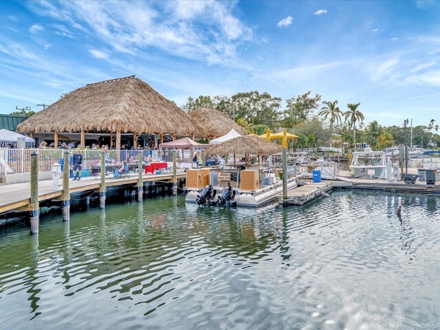 dock area with a water view and a gazebo