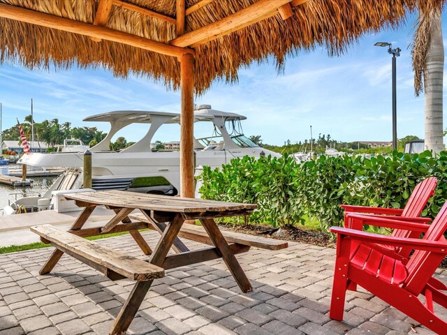 view of patio featuring a dock