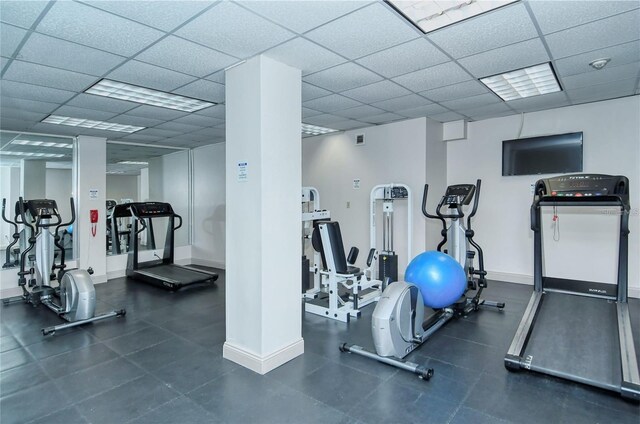 gym featuring a paneled ceiling