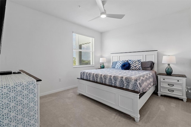 bedroom with light carpet and ceiling fan