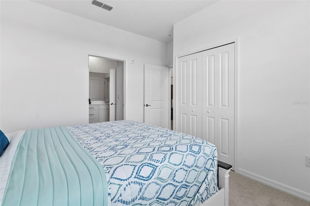 carpeted bedroom with baseboards, visible vents, and a closet