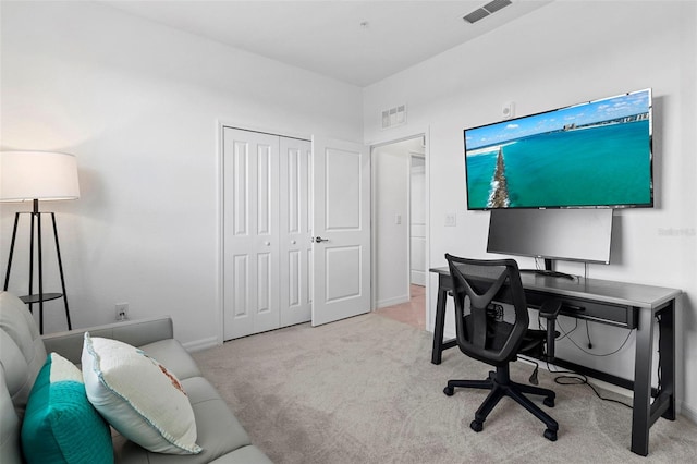 carpeted home office with baseboards and visible vents